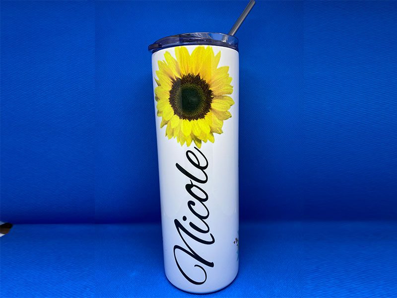 A sunflower is shown on the side of a cup.