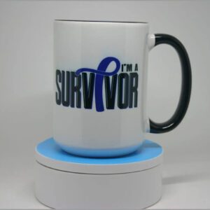 A mug that says i 'm a survivor with a blue ribbon.