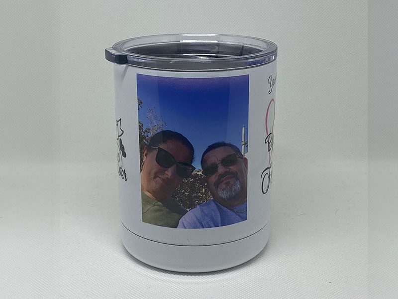 A picture of two people on the side of a cup.