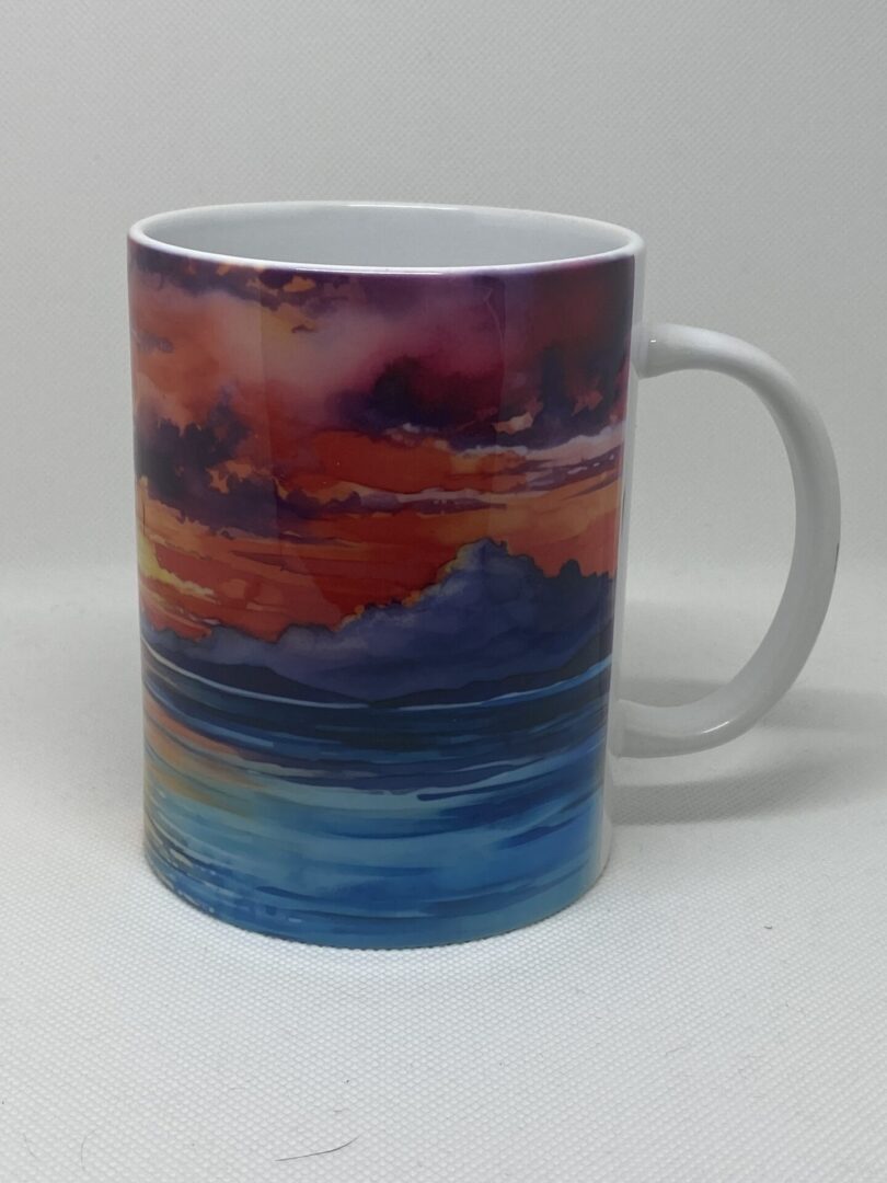 A mug with an ocean scene painted on it.