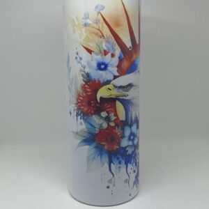 A white vase with a bird and flowers on it.