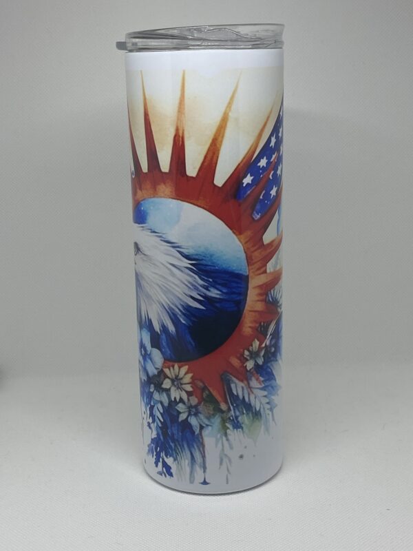 A candle with an eagle and sun on it.