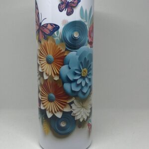 A close up of the vase with flowers and butterflies