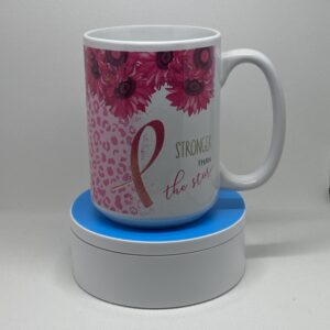 A mug sitting on top of a blue coaster.