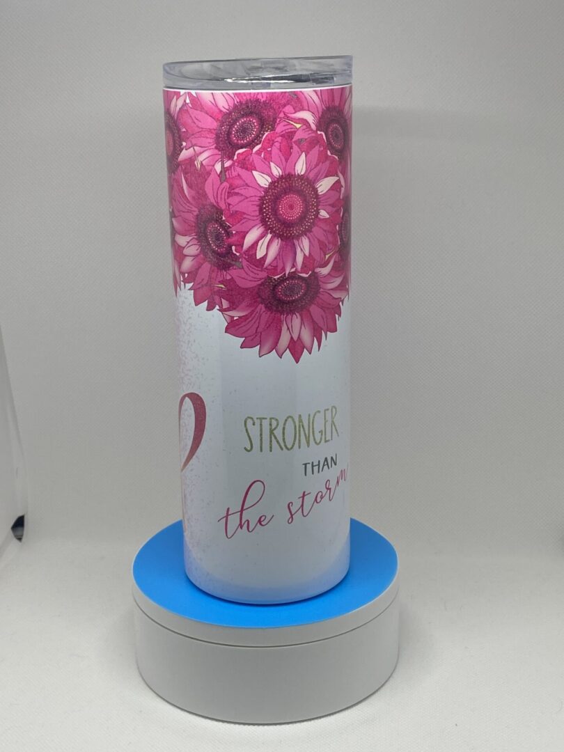 A pink flower design on the side of a water bottle.