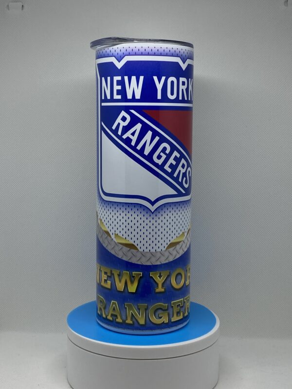 A tall candle with the new york rangers logo on it.