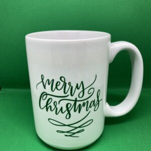 A white mug with the words " merry christmas ".