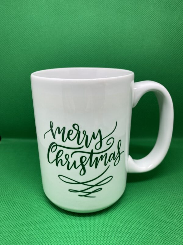 A white mug with the words " merry christmas ".