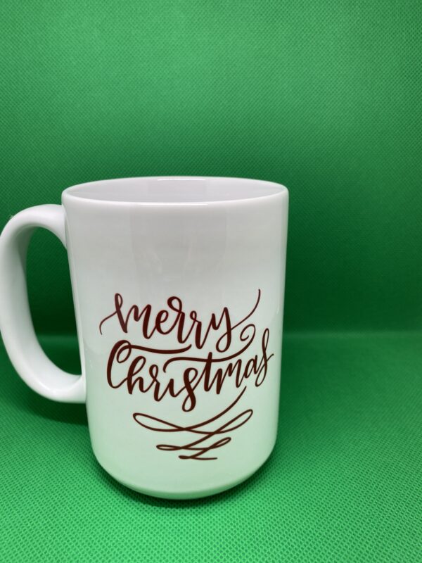 A white mug with the words " merry christmas ".