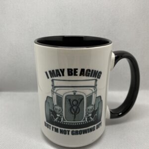 A coffee mug with an old car on it.