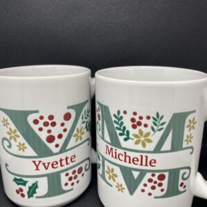 Two mugs with the letters yvette and michelle on them.