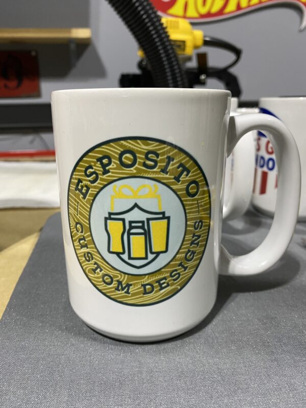 A coffee mug with the name esposito custom designs on it.