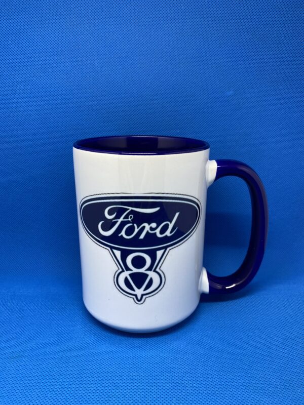 A coffee mug with the ford logo on it.