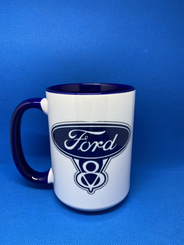 A coffee mug with the ford logo on it.