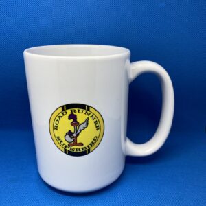 A white coffee mug with the logo of gold diggers of hollywood.