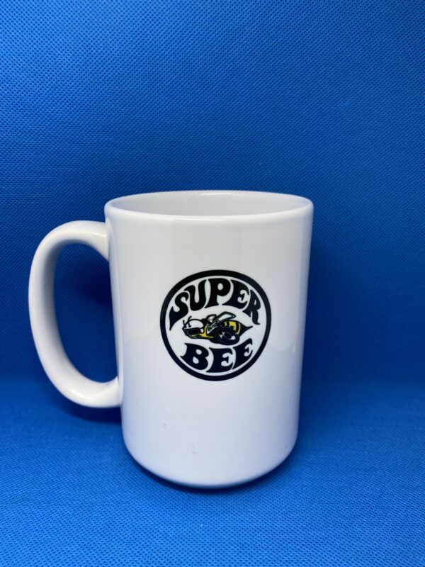 A white coffee mug with the words " super bee ".