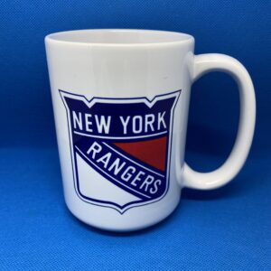 A white mug with the new york rangers logo on it.