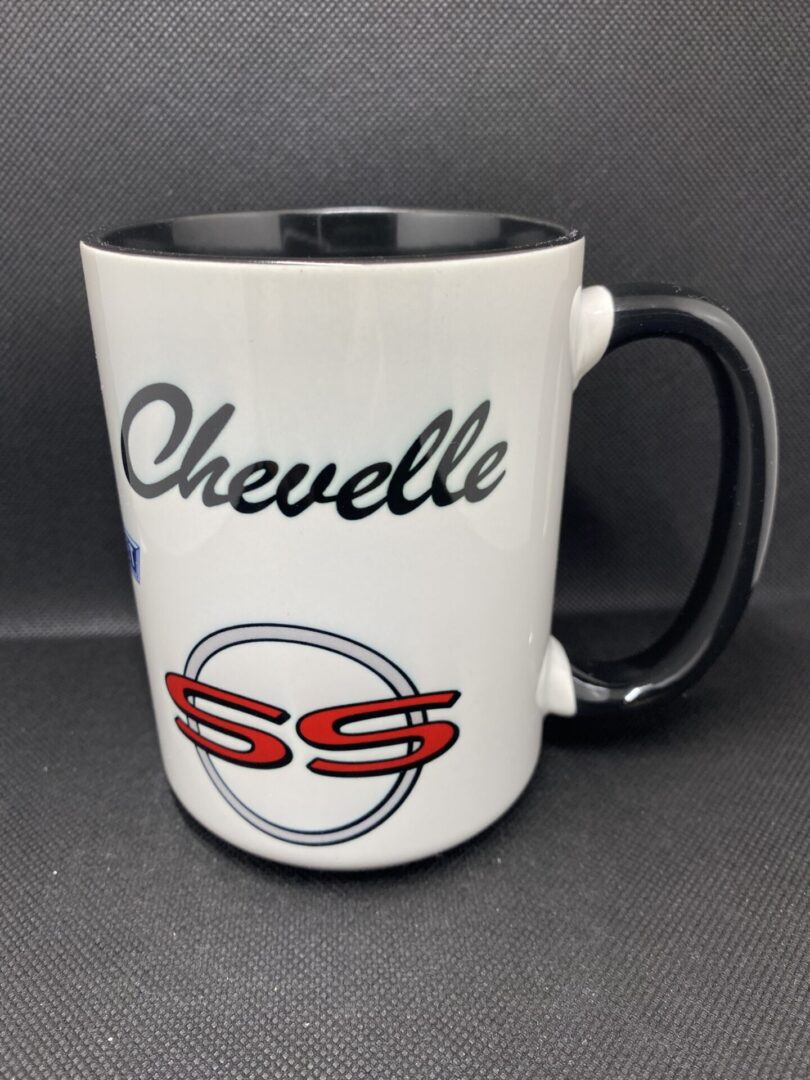 A white and black coffee mug with the word chevelle written on it.