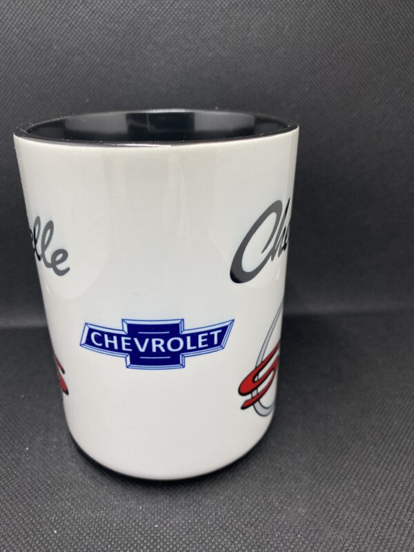 A white coffee mug with chevrolet logos on it.