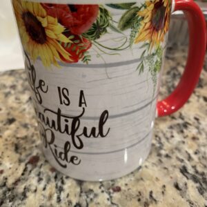 A coffee mug with the words " life is a beautiful ride ".