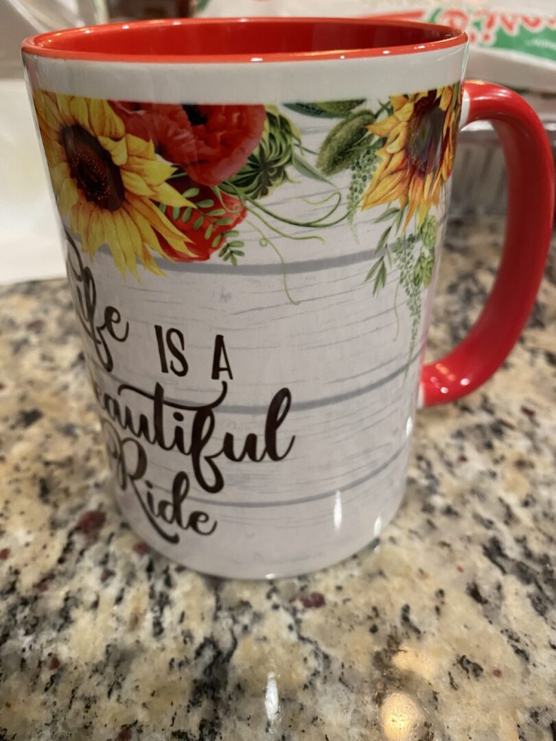 A coffee mug with the words " life is a beautiful ride ".