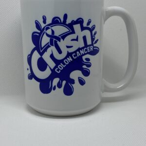 A white coffee mug with the words crush colon cancer on it.