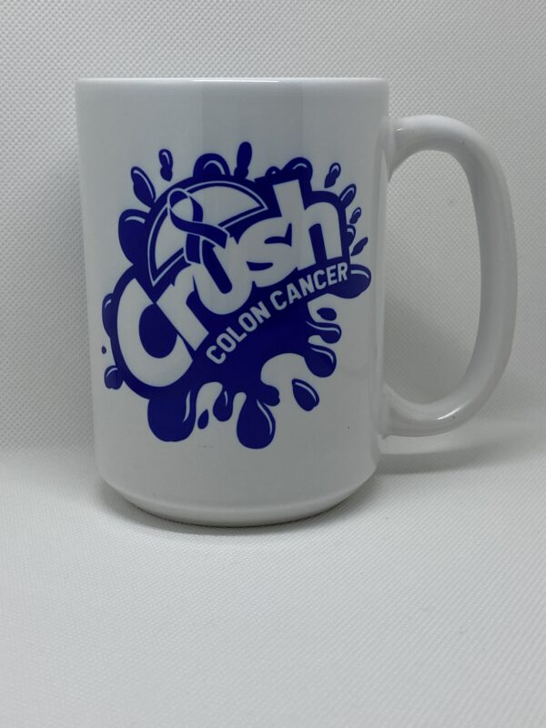 A white coffee mug with the words crush colon cancer on it.