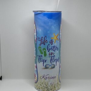 A tall glass with the words " life is better in flip flops ".