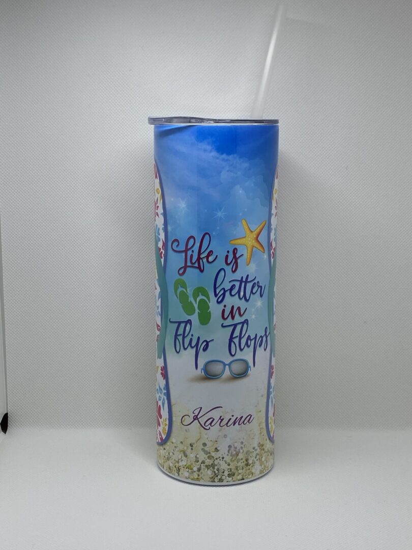 A tall glass with the words " life is better in flip flops ".