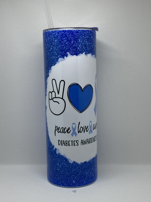 A blue candle with the words peace love and diabetes written on it.