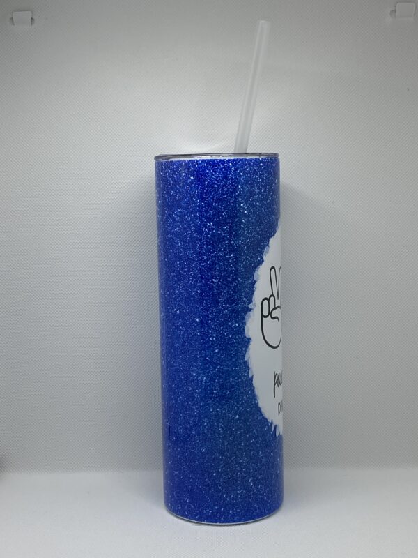 A blue candle with white writing on it