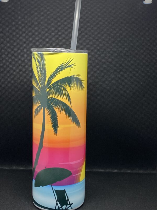 A colorful palm tree design on the side of a stainless steel tumbler.