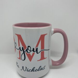 A coffee mug with the words " m " and " thank you ".