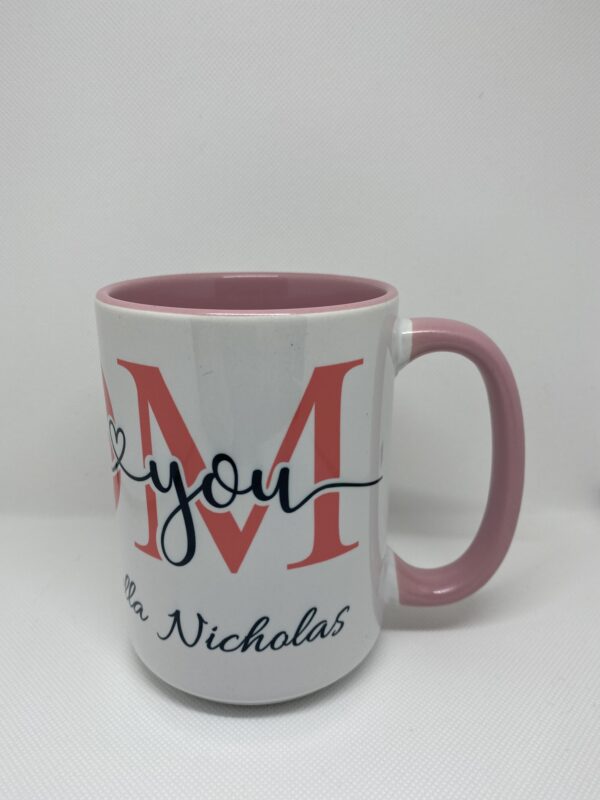 A coffee mug with the words " m " and " thank you ".