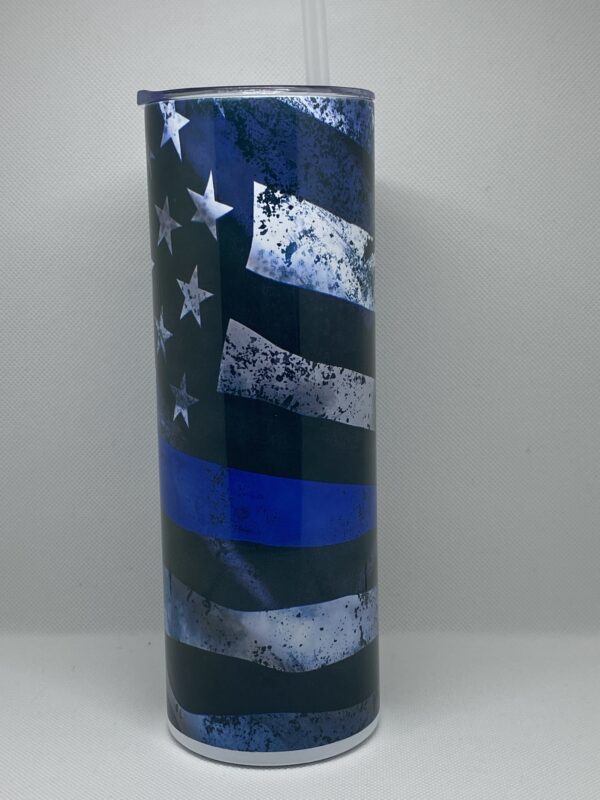 A police officer 's mug with the american flag and blue line.