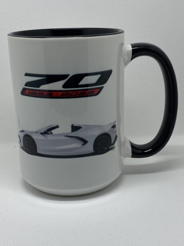 A coffee mug with the image of a sports car.