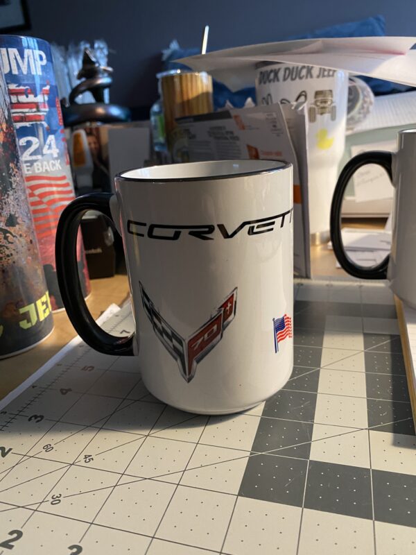 A coffee mug with the word corvette on it.