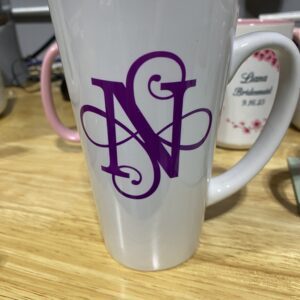 A close up of the letter n on a coffee cup