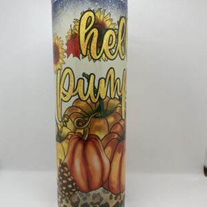 A candle that says hello pumpkin with pumpkins and leaves.