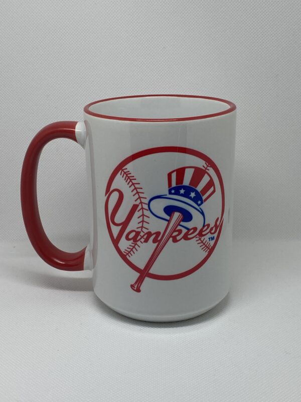 A red and white mug with the yankees logo on it.