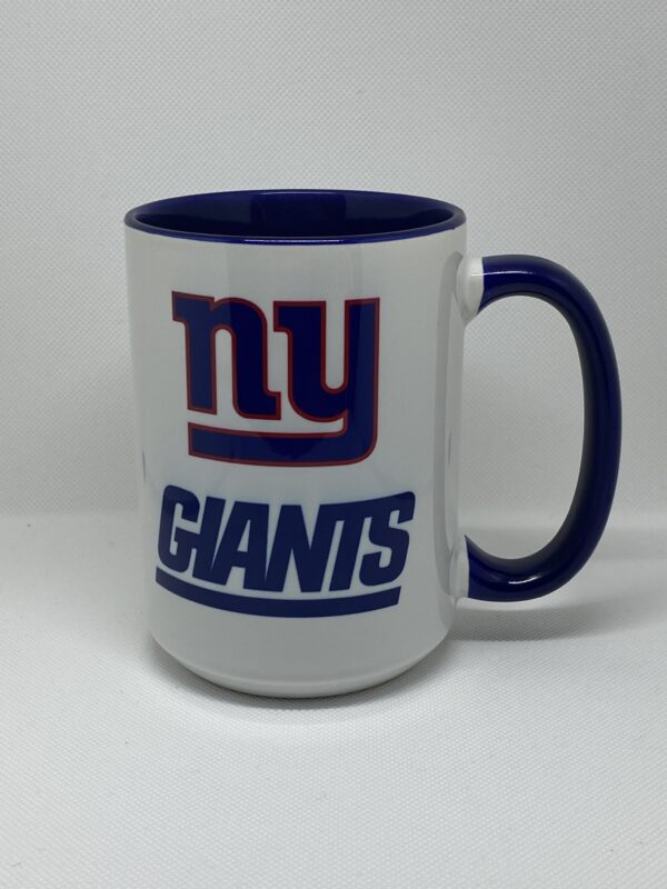 A coffee mug with the new york giants logo on it.