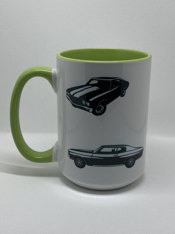 A coffee mug with two different cars on it.