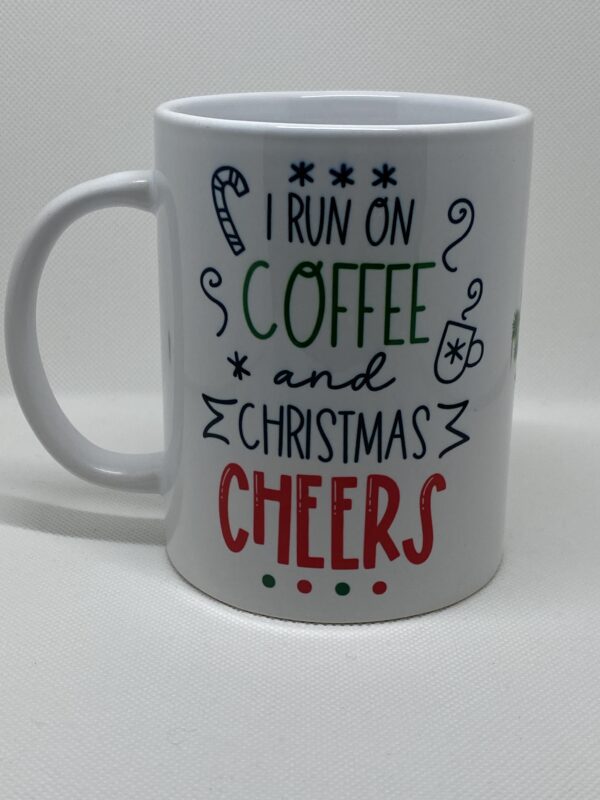 A coffee mug that says i run on christmas and coffee cheers.