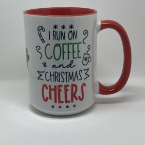 A coffee mug that says i run on christmas and coffee cheers.