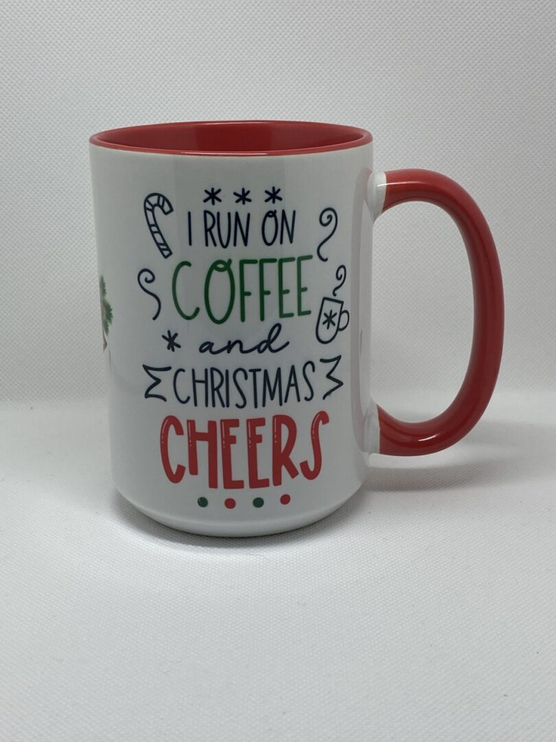 A coffee mug that says i run on christmas and coffee cheers.