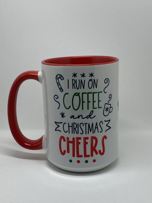 A coffee mug that says i run on christmas and coffee cheers.