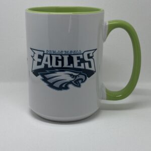 A coffee mug with the eagles logo on it.