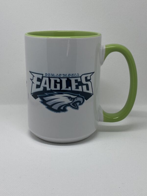 A coffee mug with the eagles logo on it.