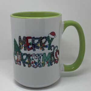 A green and white mug with the words merry christmas written in it.