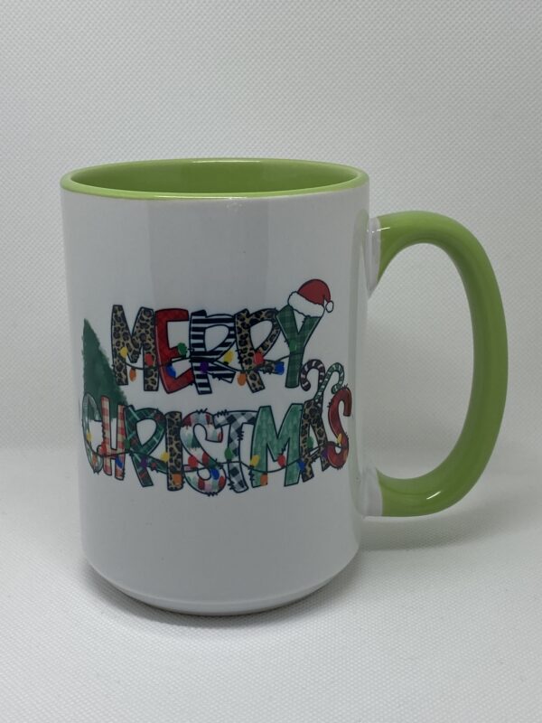 A green and white mug with the words merry christmas written in it.